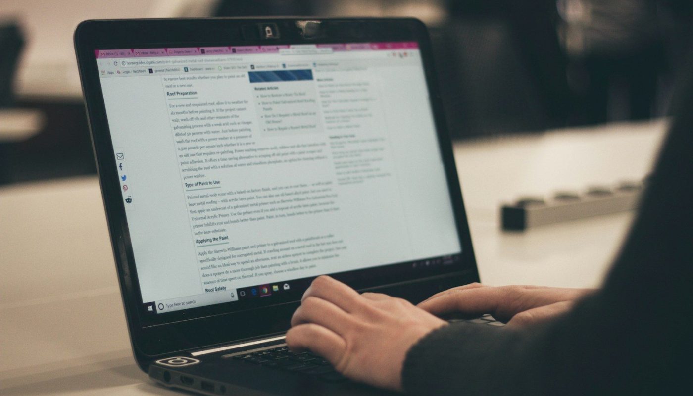 person typing on laptop computer