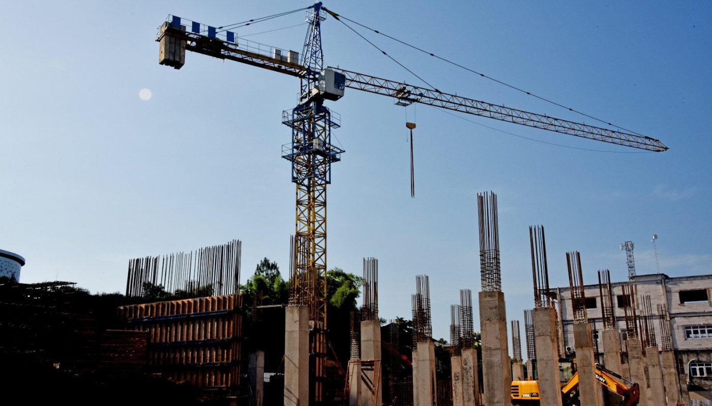a construction site with a crane in the background