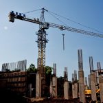 a construction site with a crane in the background