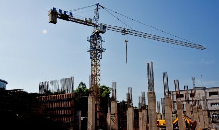 a construction site with a crane in the background