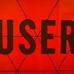 a close up of the word user on a wall